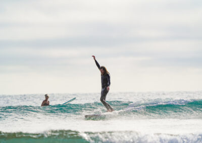 Guy Surfing at Agnes Water - Coral and Co